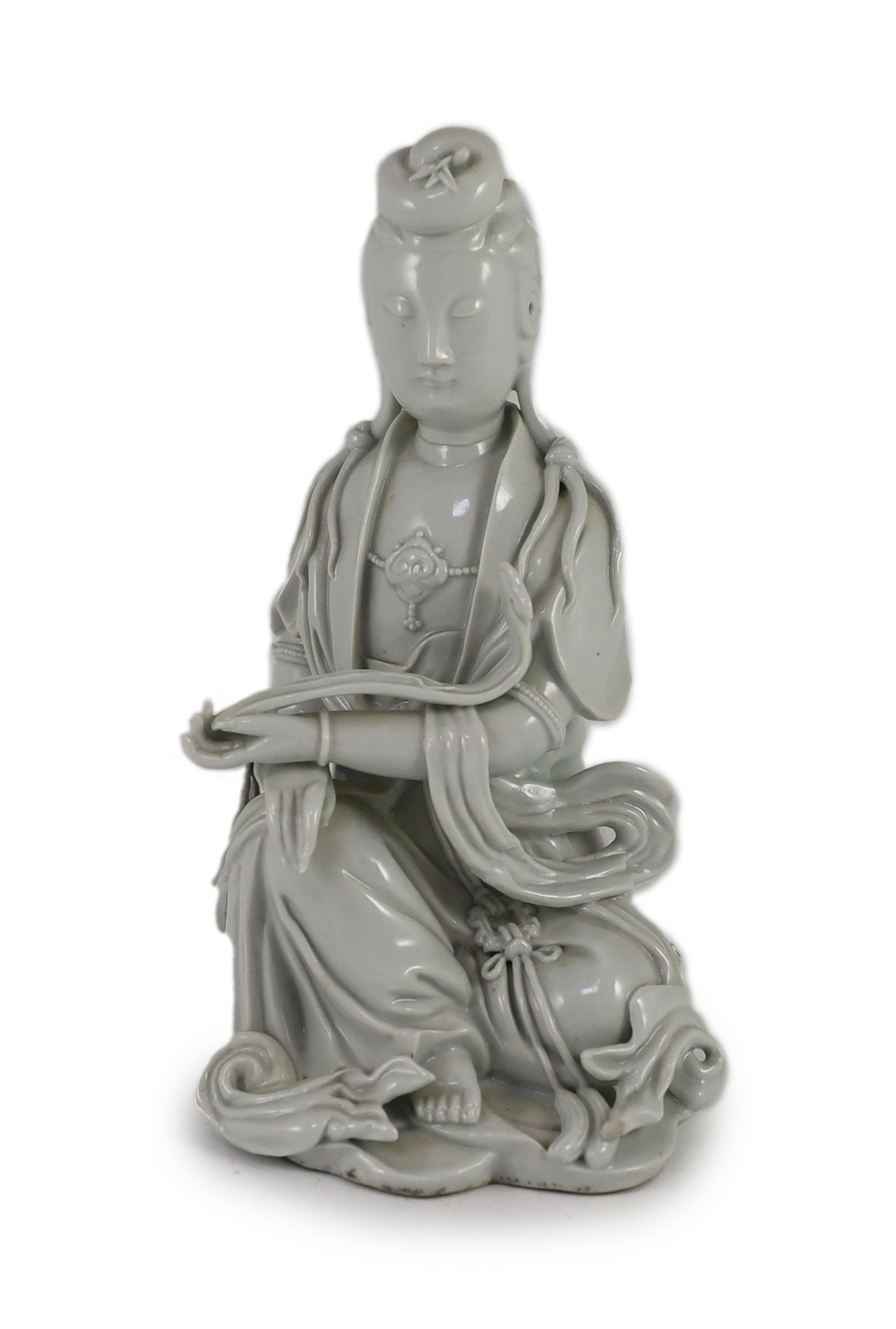 A Chinese blanc-de-chine seated figure of Guanyin, Dehua kilns, 19th/20th century, 23cm high
